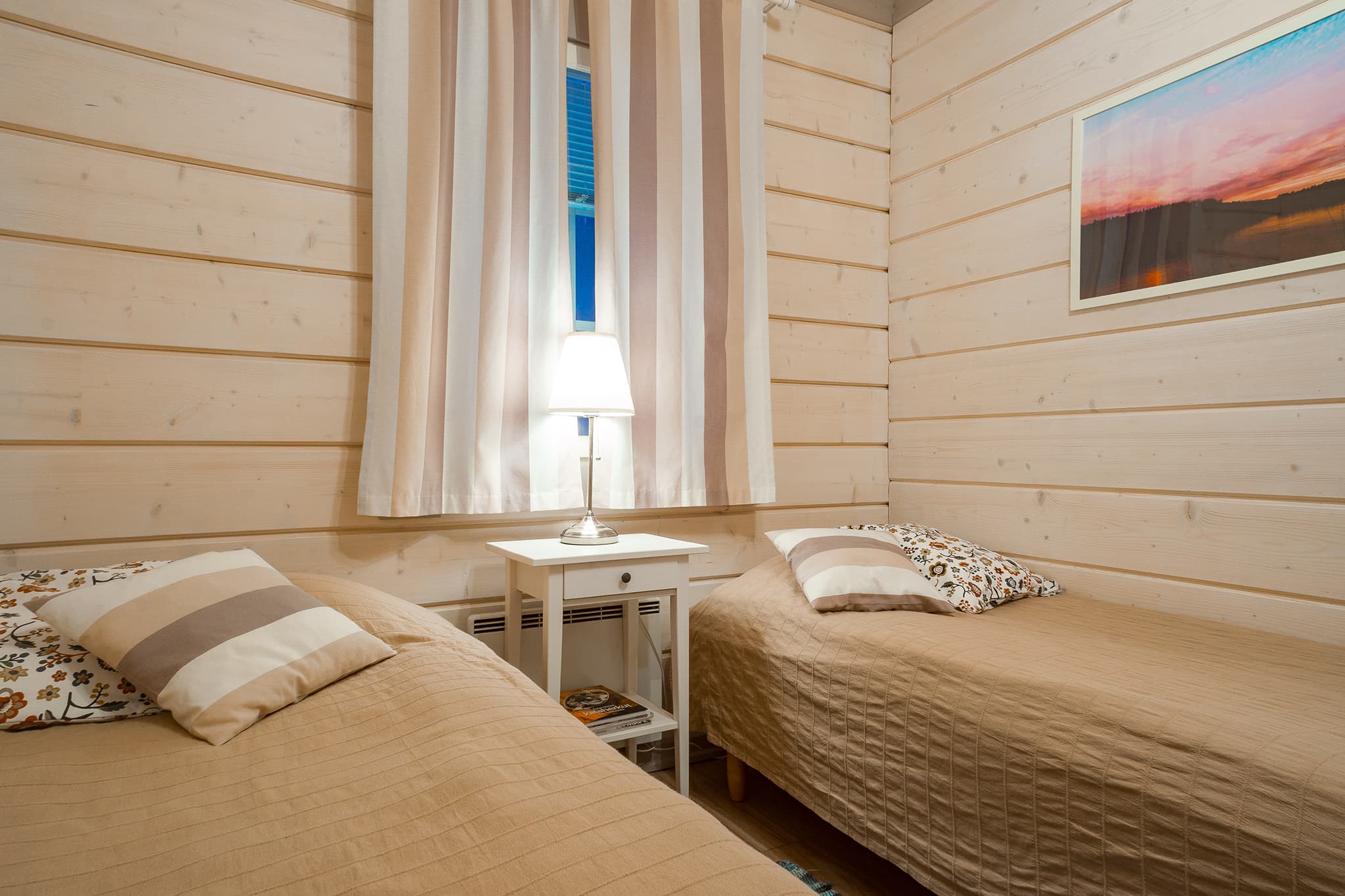 There are two single beds in the second bedroom