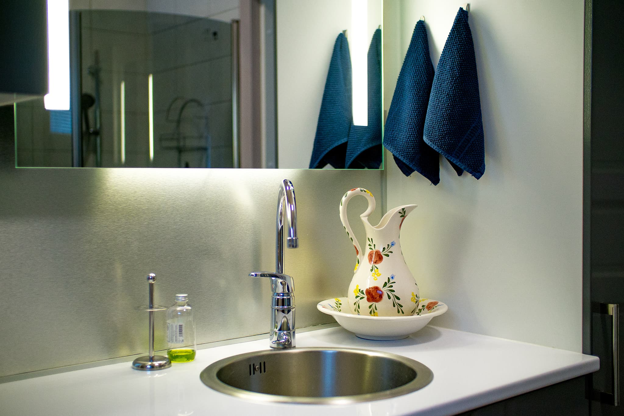 Bathroom with shower and washing machine